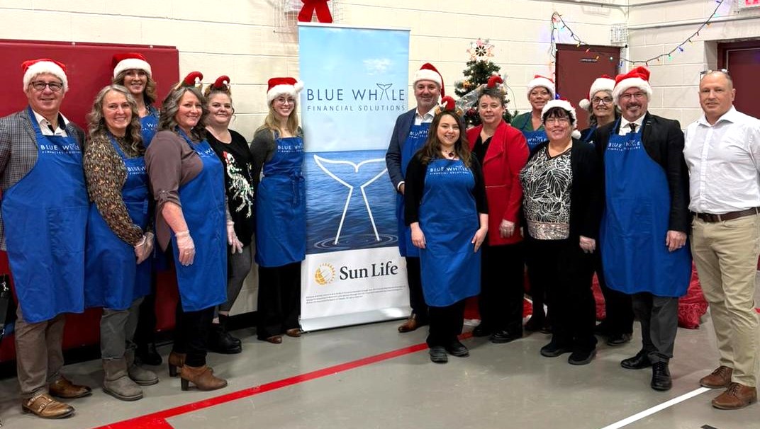 Santa and Blue Whale Financial bring Christmas dinner to St. Agnes School